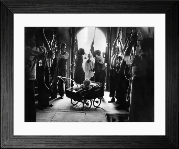Framed Print : Baby in the belfry. Sitting happily in his pram, watching the efforts of his mummie Framed Print : Baby in the belfry. Sitting happily in his pram, watching the efforts of his mummie