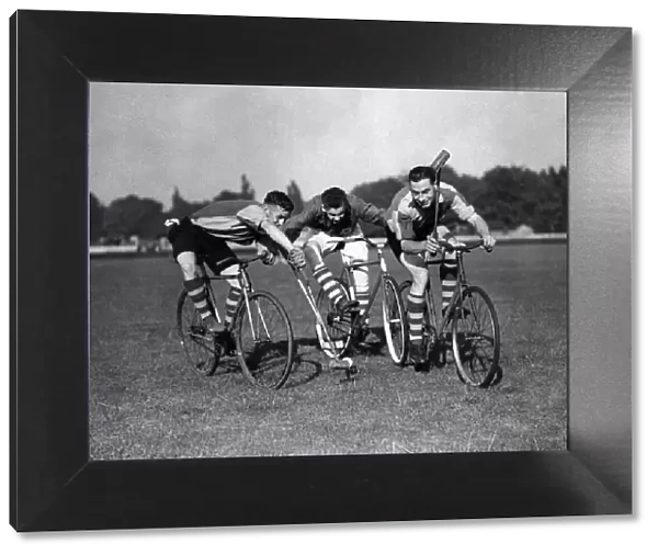 Three fellows playing Cycle polo which was invented in County Wicklow, Ireland