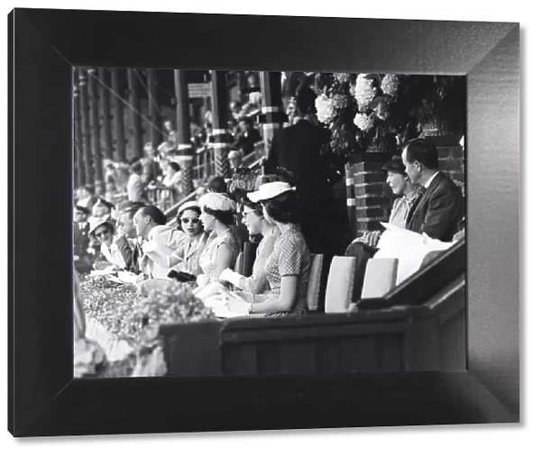 Queen Elizabeth II seen here chatting with Princess Margaret in the royal box at