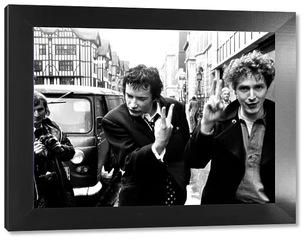 Sex Pistols singer Johnny Rotten leaving Malborough Street Court with Malcolm McLaren