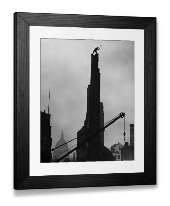 Framed Print : Workman James Woods demolishing a chimney stack with his pickaxe in the shadow of St Framed Print : Workman James Woods demolishing a chimney stack with his pickaxe in the shadow of St