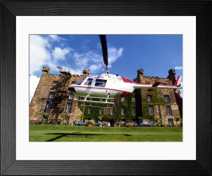 Framed Print : A Bell Jet Ranger helicopter lands at Lumley Castle, Chester-le Street Framed Print : A Bell Jet Ranger helicopter lands at Lumley Castle, Chester-le Street