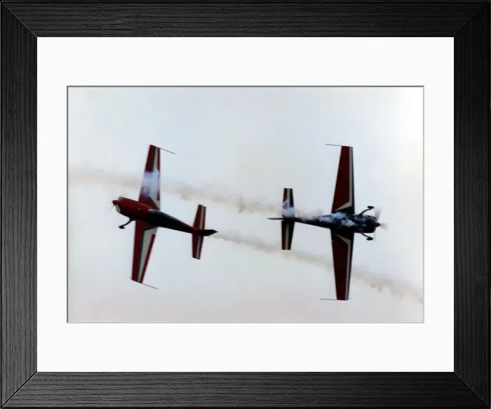 Framed Print : Royal Jordanian Falcons display team performing in their Extra EA300 aircraft Framed Print : Royal Jordanian Falcons display team performing in their Extra EA300 aircraft