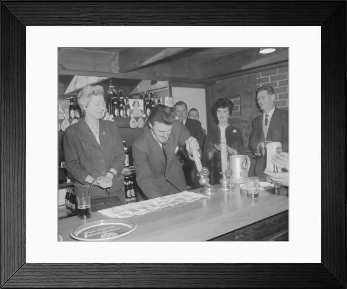 Framed Print : Jimmy Hill tries his hand at pulling a pint of beer at the official opening of The Rose Framed Print : Jimmy Hill tries his hand at pulling a pint of beer at the official opening of The Rose