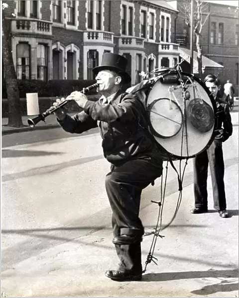 One-Man-Band - With all his complicated apparatus and his collecting box stuck on the end