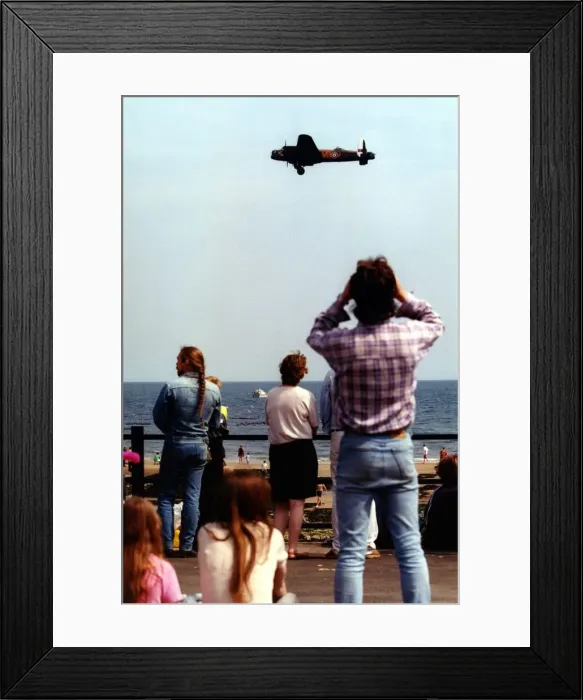 Framed Print : An Avro Lancaster bomber aircraft of the Battle of Britain Memorial Flight flies past Framed Print : An Avro Lancaster bomber aircraft of the Battle of Britain Memorial Flight flies past