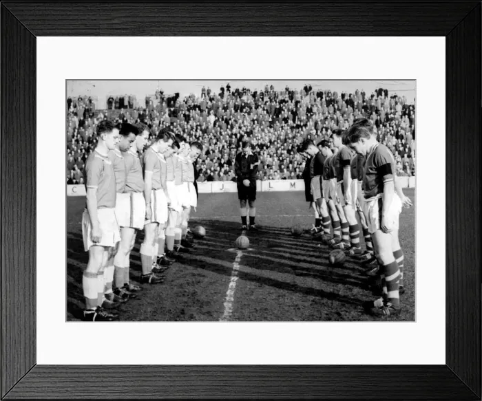 Framed Print : players on football pitches throughout Britain stood in silent tribute to the brillian Framed Print : players on football pitches throughout Britain stood in silent tribute to the brillian