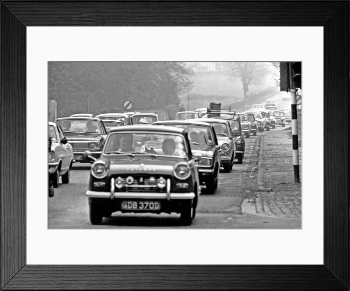 Framed Print : Traffic built up along the A556 towards Manchester, as traffic poured home from North Framed Print : Traffic built up along the A556 towards Manchester, as traffic poured home from North