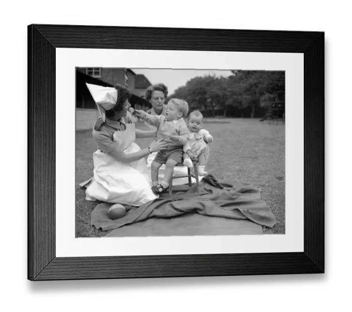 Framed Print : Sister Rose Pedel pictured here holding two small children who had been placed in Stepney Framed Print : Sister Rose Pedel pictured here holding two small children who had been placed in Stepney