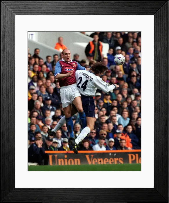 Framed Print : Villas mark Draper jumps up for the ball with Tim Sherwood of Spurs during Framed Print : Villas mark Draper jumps up for the ball with Tim Sherwood of Spurs during