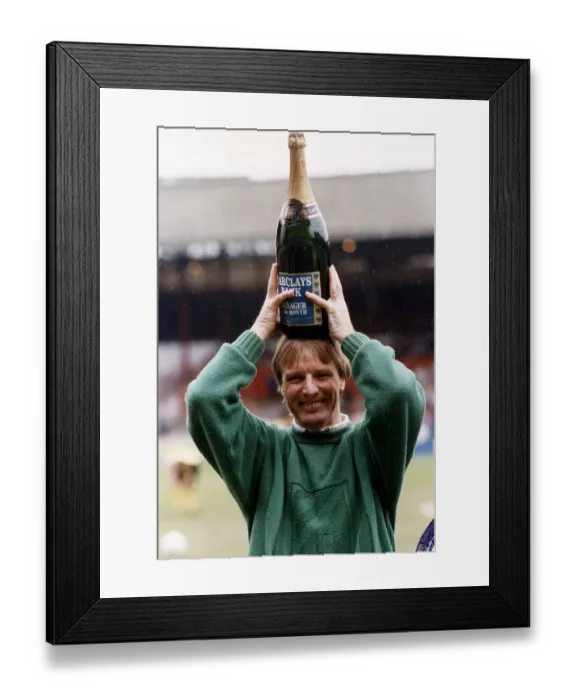 Framed Print : Sheffield United football manager Dave Bassett holds a bottle of champagne above his head Framed Print : Sheffield United football manager Dave Bassett holds a bottle of champagne above his head