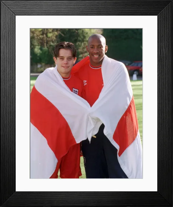 Framed Print : Dion Dublin and Lee Hendrie of Aston Villa wrapped in the England flag at an England