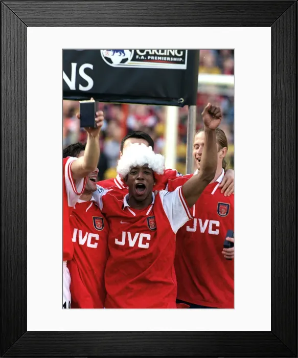 Framed Print : Arsenal footballer Ian Wright celebrates with team mates after the 4-0 victory over Framed Print : Arsenal footballer Ian Wright celebrates with team mates after the 4-0 victory over