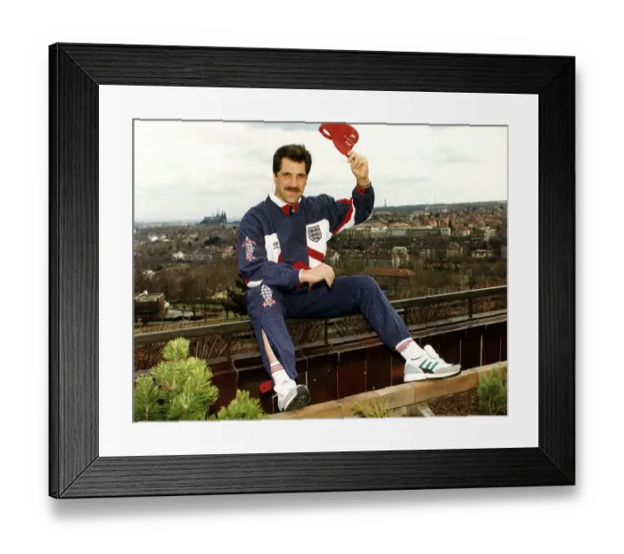 Framed Print : Arsenal and England goalkeeper David Seaman sitting on the railings wearing an England