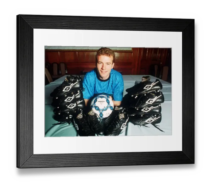 Framed Print : England footballer Alan Shearer footballer posing surrounded by football boots, 1992 Framed Print : England footballer Alan Shearer footballer posing surrounded by football boots, 1992