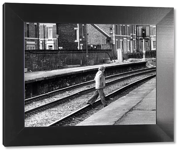 A man illegally crossing the railway line at West Jesmond Station on 12th March