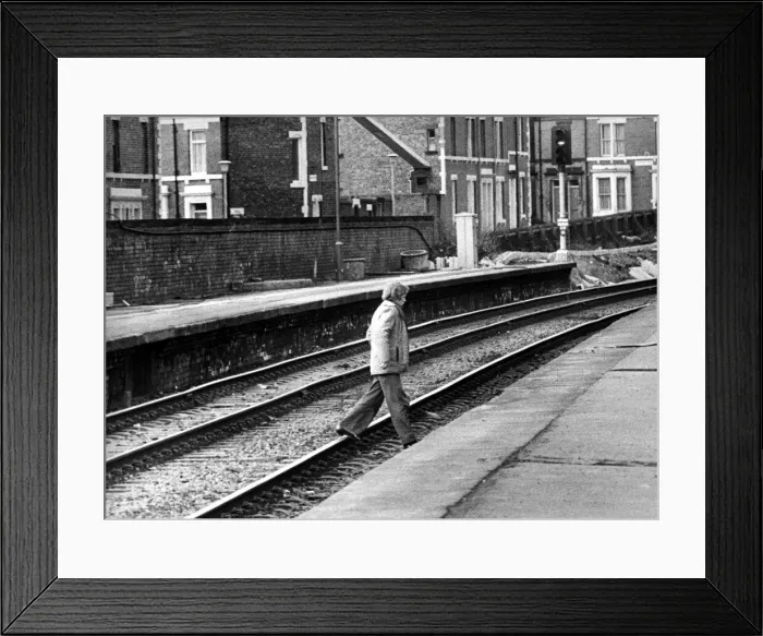 Framed Print : A man illegally crossing the railway line at West Jesmond Station on 12th March Framed Print : A man illegally crossing the railway line at West Jesmond Station on 12th March