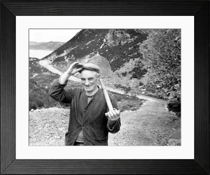 Framed Print : Crofter, Callum MacLeod, 63, shoulders his shovel after another day Framed Print : Crofter, Callum MacLeod, 63, shoulders his shovel after another day