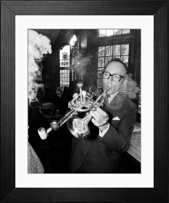 Framed Print : Mr Brian Cole winner of the Remarkable Pipe Contest seen here smoking  /  playing his