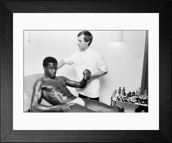 Framed Print : Justin Fashanu, Nottingham Forest Football Player, on the treatment table Framed Print : Justin Fashanu, Nottingham Forest Football Player, on the treatment table