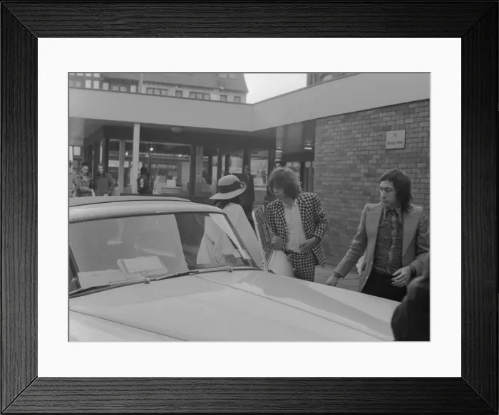 Framed Print : Mick Jagger, his girlfriend Bianca Macias and Charlie Watts arrive at Coventry Theatre