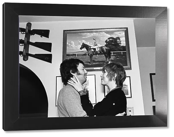 Eric Clapton and wife Pattie Boyd, pictured in front of a photograph of his racehorse Via
