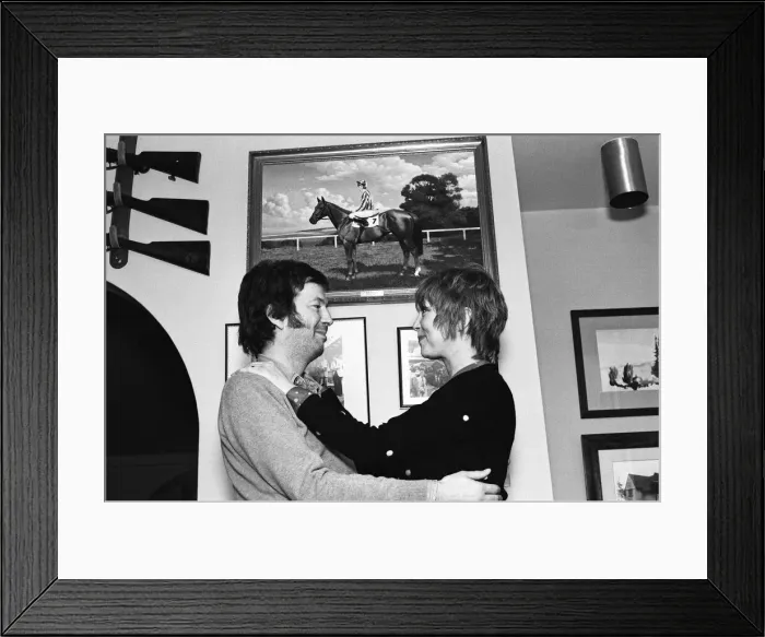 Framed Print : Eric Clapton and wife Pattie Boyd, pictured in front of a photograph of his racehorse Via Framed Print : Eric Clapton and wife Pattie Boyd, pictured in front of a photograph of his racehorse Via