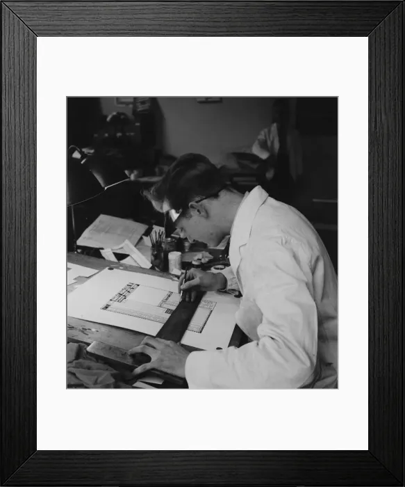 Framed Print : An artists preparing pools coupons for the following week at the Unity Pools headquarters Framed Print : An artists preparing pools coupons for the following week at the Unity Pools headquarters