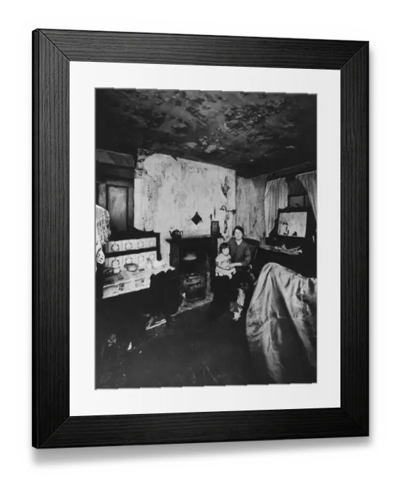 Framed Print : Woman and child in slum housing scene, Liverpool. Circa 1935
