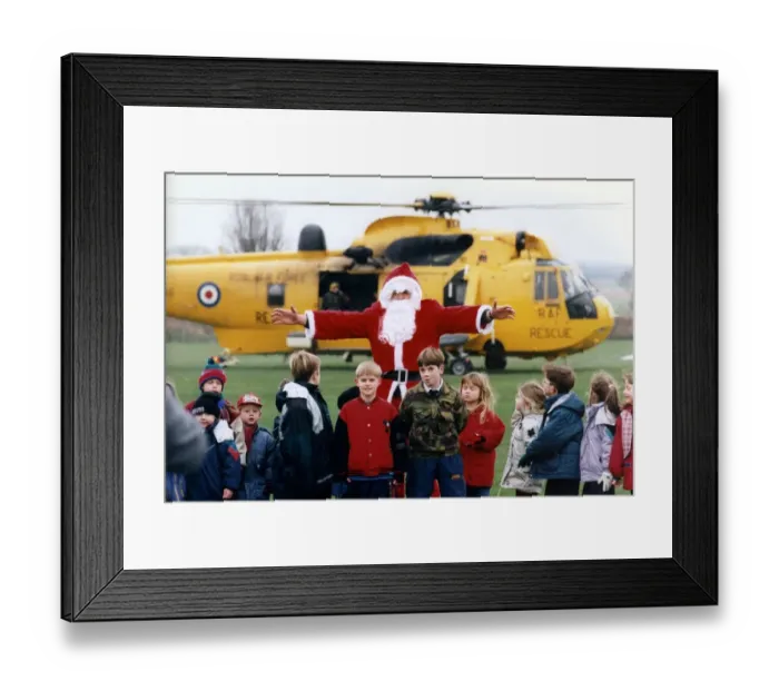 Framed Print : A RAF search and rescue Westland Sea King helicopter. Santa Claus Framed Print : A RAF search and rescue Westland Sea King helicopter. Santa Claus