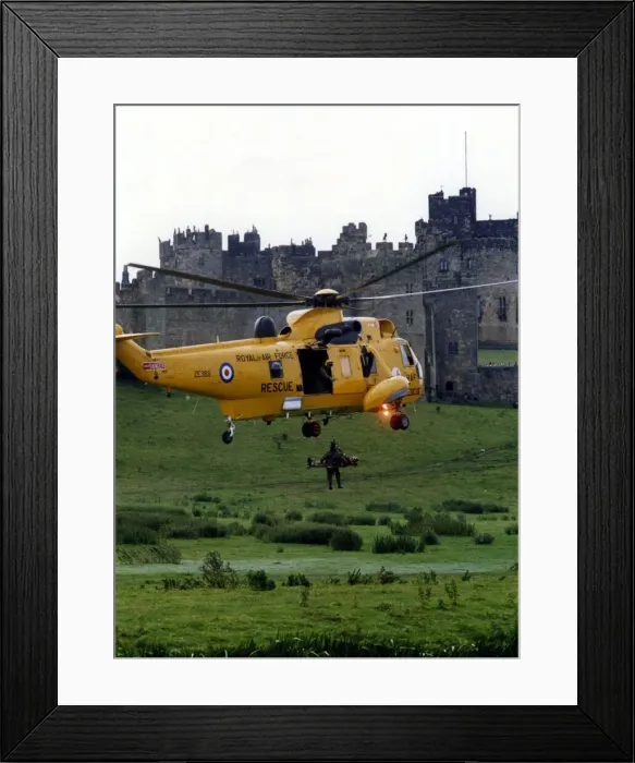 Framed Print : A RAF search and rescue Westland Sea King helicopter from RAF Boulmer demonstrates rescue