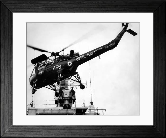 Framed Print : A Royal Navy Westland Wasp anti-submarine helicopter leaves HMS Yarmouth to fly to it