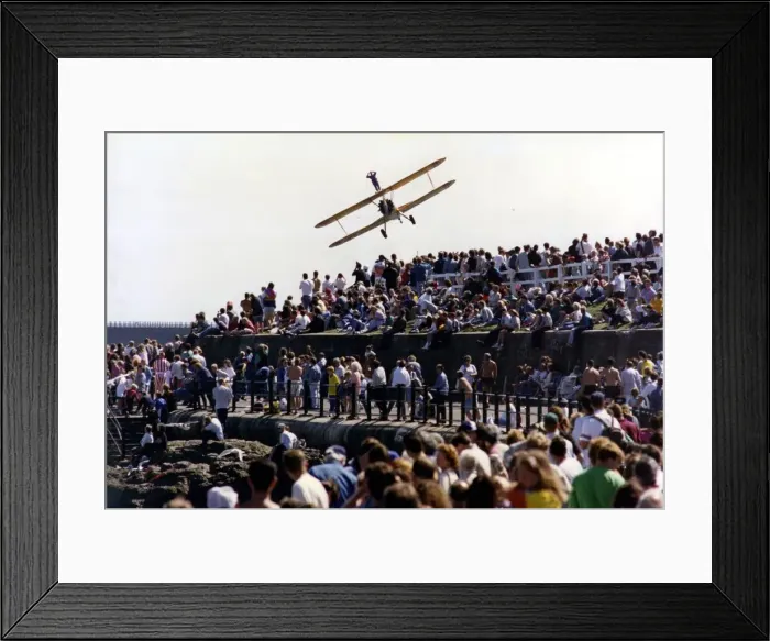 Framed Print : A wing walker performs on the Cadburys Crunchie Boeing-Stearman Model 75 biplane