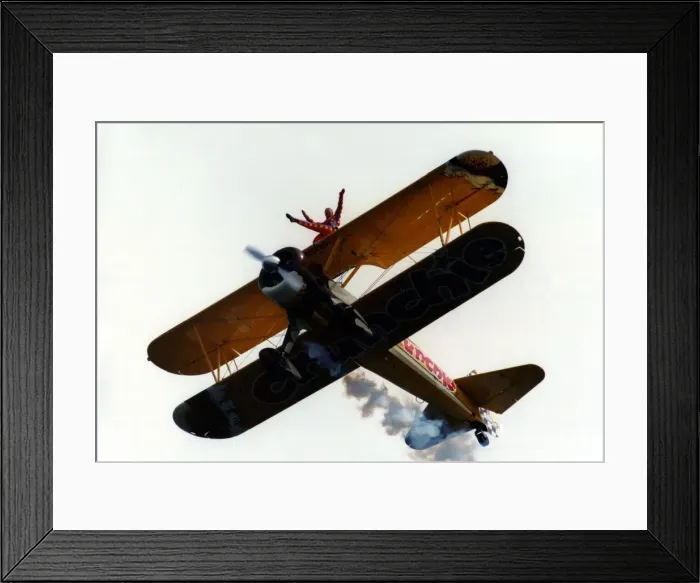 Framed Print : A wing walker performs on the Cadburys Crunchie Boeing-Stearman Model 75 biplane Framed Print : A wing walker performs on the Cadburys Crunchie Boeing-Stearman Model 75 biplane
