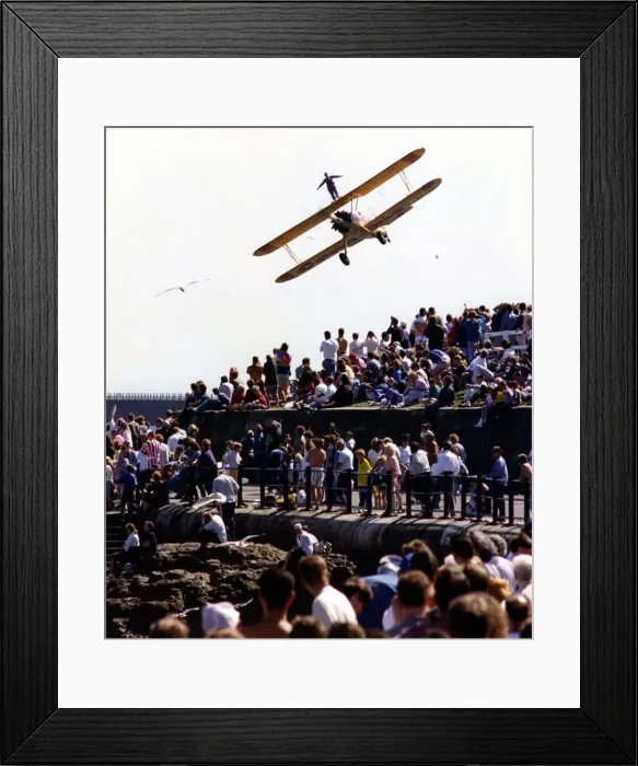 Framed Print : A wing walker performs on the Cadburys Crunchie Boeing-Stearman Model 75 biplane Framed Print : A wing walker performs on the Cadburys Crunchie Boeing-Stearman Model 75 biplane