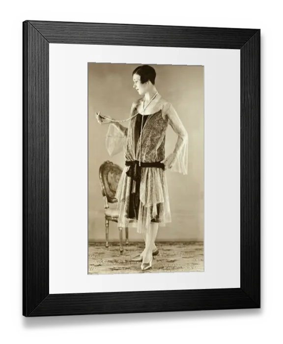 Framed Print : Eveningwear circa 1925. Woman modelling the trends of 1926 Framed Print : Eveningwear circa 1925. Woman modelling the trends of 1926