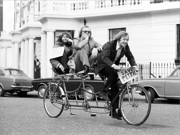 The Goodies, on the perfect answer to petrol rationing, ride their three seater tandem