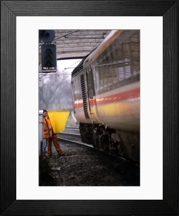 Framed Print : A British Rail workman using the old fashioned hand and flag signal on 1st, December 1994 Framed Print : A British Rail workman using the old fashioned hand and flag signal on 1st, December 1994