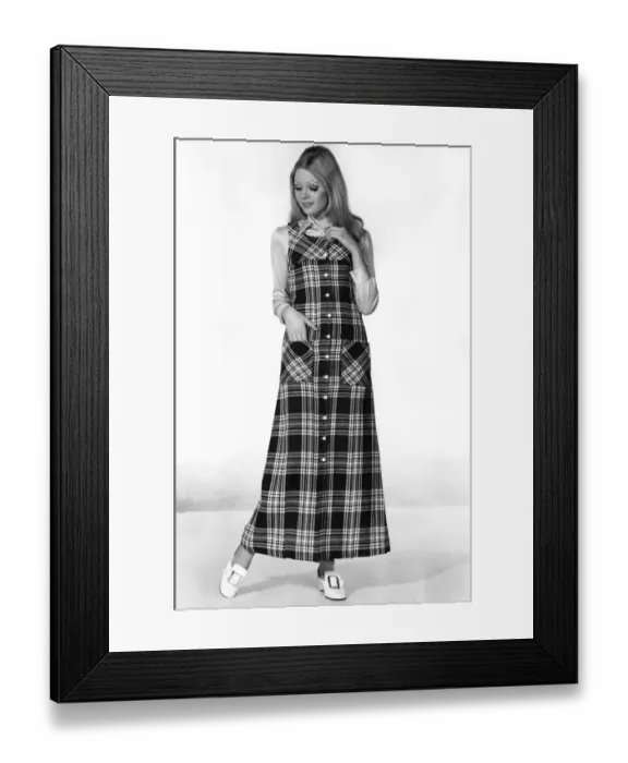 Framed Print : Clothing Fashion 1970: Cross Check Little girl look for a plaid pinafore