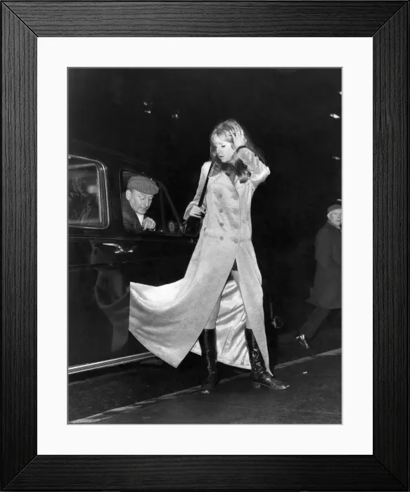 Framed Print : Clothing Coats: The current British fashion of wearing maxi coats has revealed many Framed Print : Clothing Coats: The current British fashion of wearing maxi coats has revealed many