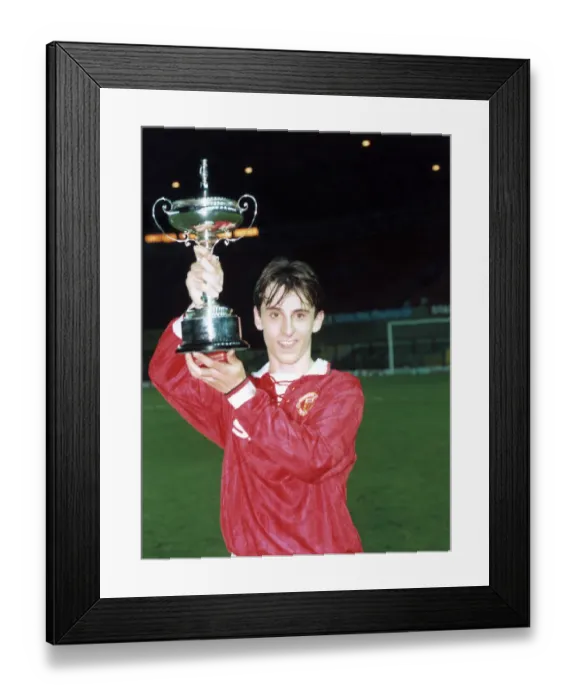 Framed Print : Manchester United youth team player Gary Neville holds up the FA Lancashire Youth Cup