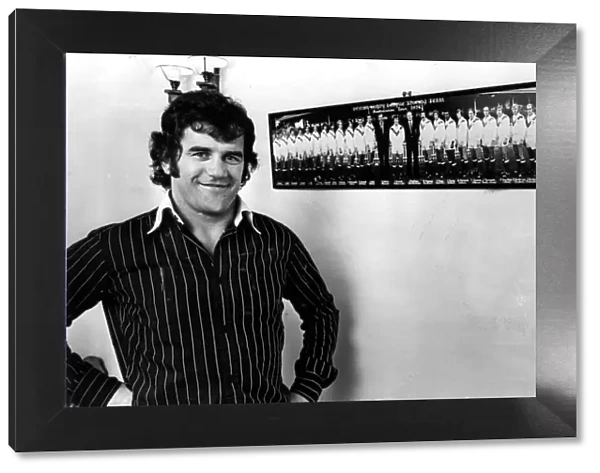 Former Newport and Wales international David Watkins pictured in front of a photo of