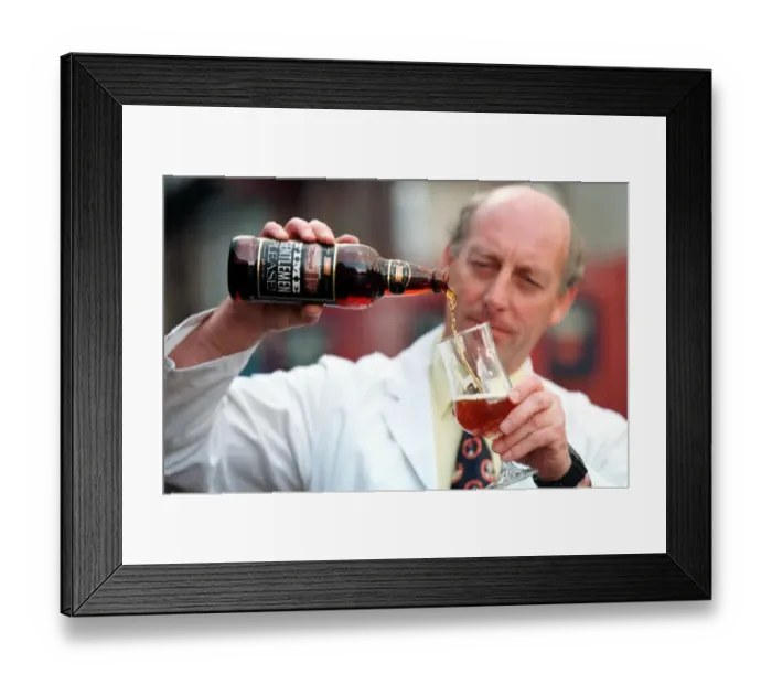 Framed Print : The Vaux Brewery in Sunderland - Vaux brewer Jim Murray pours a glass of Time Please ale