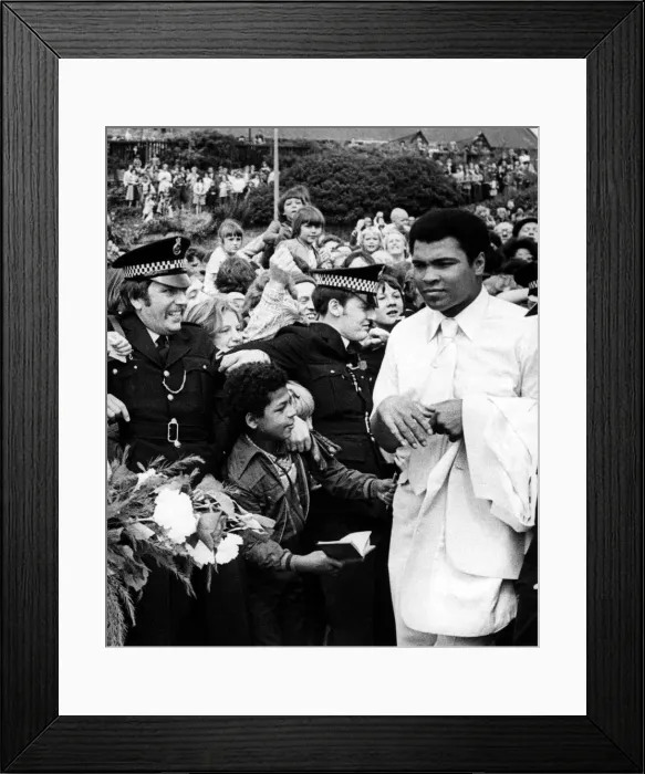 Framed Print : Muhammad Alis visit to the North East of England. A young autograph hunter Framed Print : Muhammad Alis visit to the North East of England. A young autograph hunter