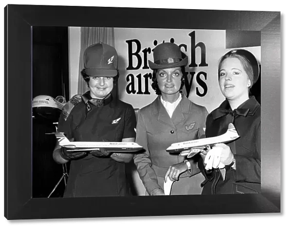 Airline stewardesses use model aircraft to show off the new red
