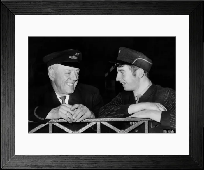Framed Print : Mr. W. Duddy in the old style British Rail hat talks to Lad Porter T Framed Print : Mr. W. Duddy in the old style British Rail hat talks to Lad Porter T