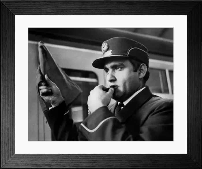 Framed Print : Mr. Prem Vohra, an inter-city rail guard, whistles out Framed Print : Mr. Prem Vohra, an inter-city rail guard, whistles out