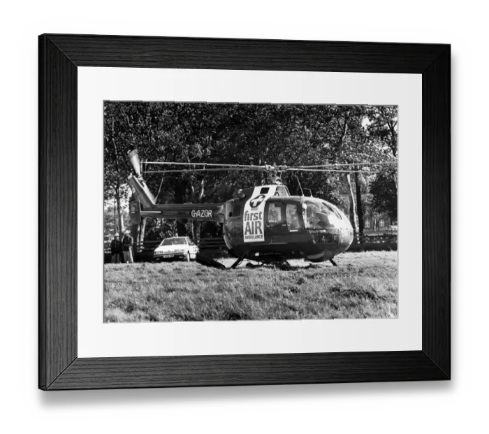 Framed Print : A MBB Bolkow BO105 Air Ambulance helicopter takes off from a landing site near the Royal