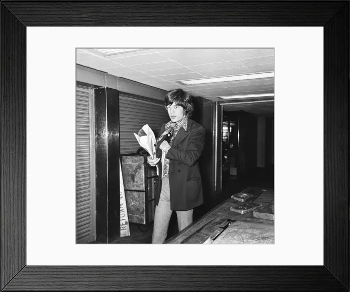 Framed Print : Mick Jagger seen here passing through passport control at London Airport as he flies of Framed Print : Mick Jagger seen here passing through passport control at London Airport as he flies of