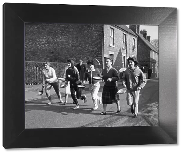 The start of the pancake race at Whittington near Lichfield which was won by Mrs Janet